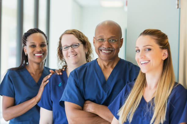 Smiling medical team of doctors and nurses in a bright clinic
